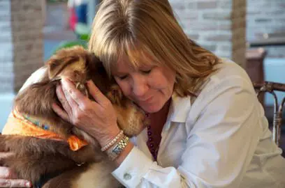 Nancy Bown petting a dog