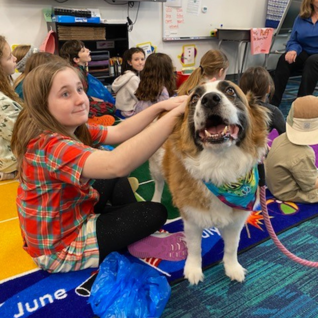 photograph of therapy dog vivian at dune lakes elementary for literacy night in santa rosa beach, fl