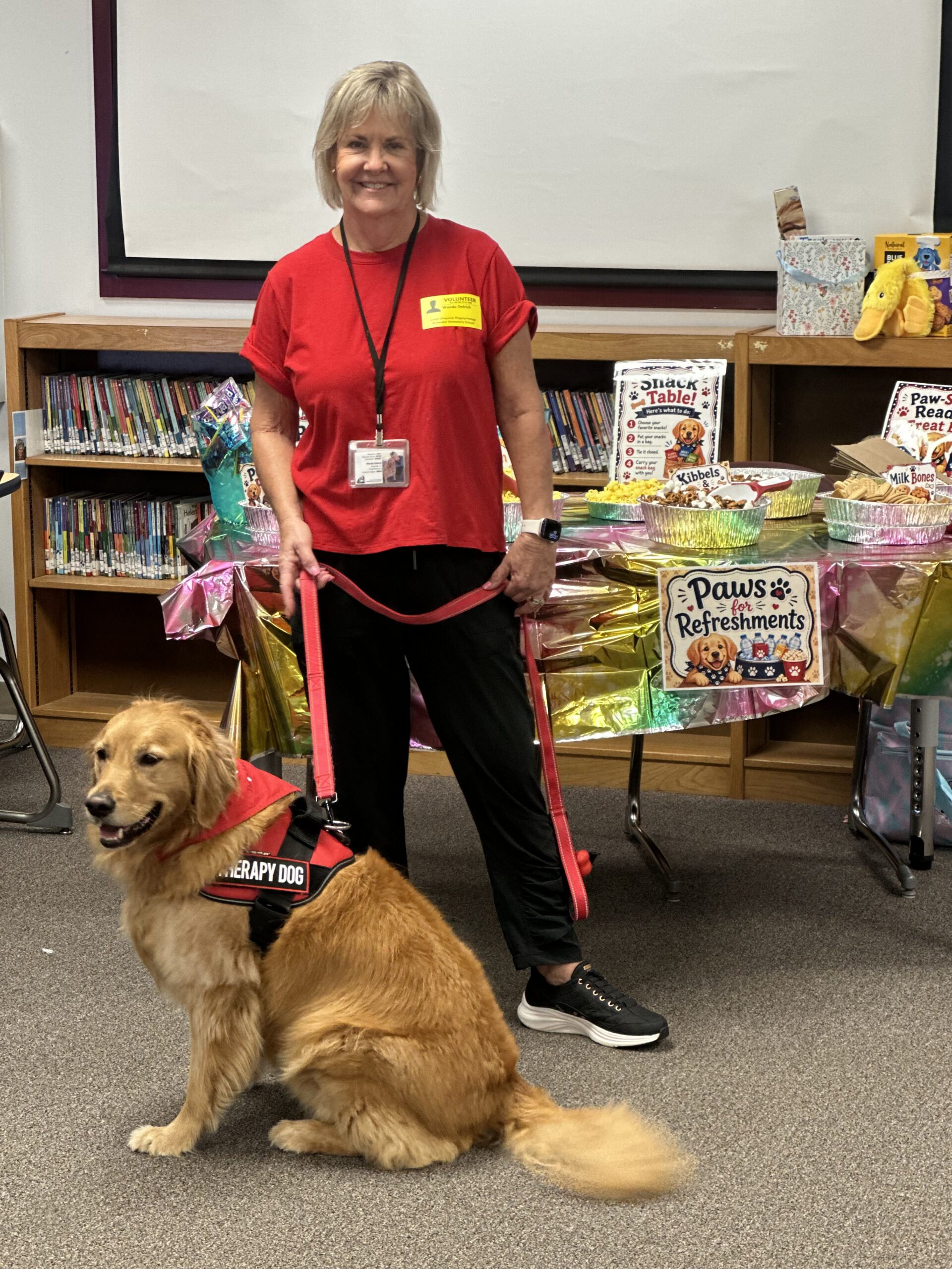 photograph of millie the therapy dog with her handler